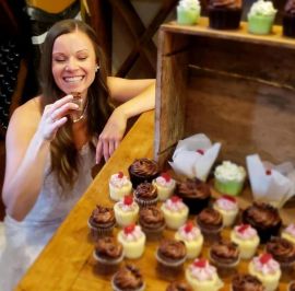 Bride sneaking her mini cupcake