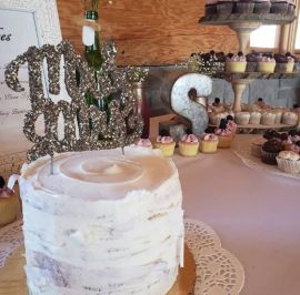 Birch bark centerpiece cutting cake with complimentry minis